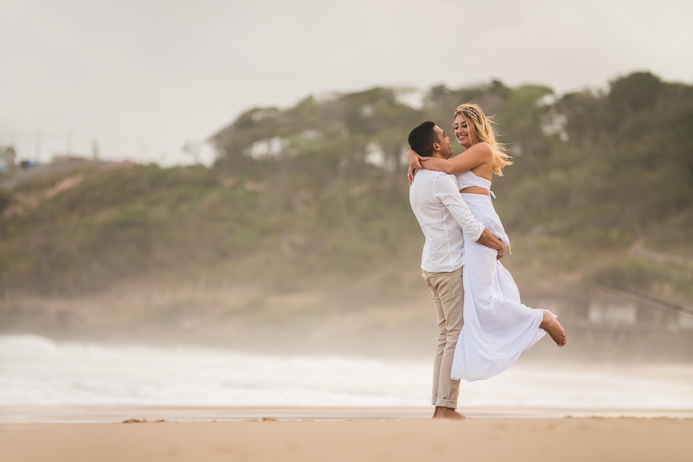 Elopement wedding, groom hugging and lifting bride